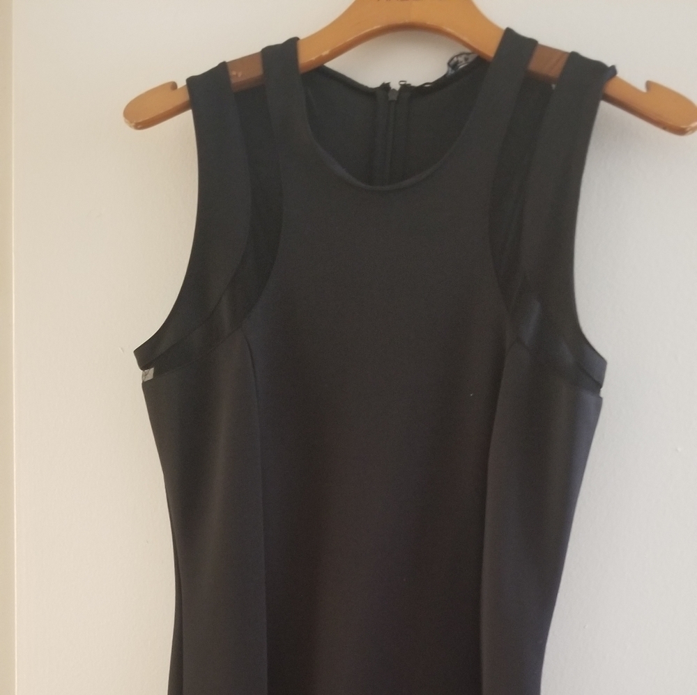 Black dress with mesh cut out on sleeve